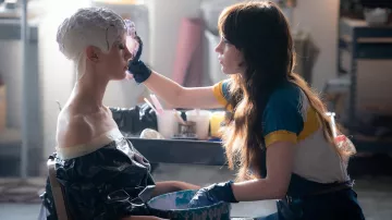 MaXXXine Movie Outfits: Lily Collins is wearing a t-shirt to portray Molly