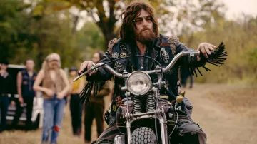 The Bikeriders Outfits: Funny Sonny (Norman Reedus) is wearing Multi patches denim jacket in the movie