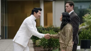 Jackpot! Movie Outfits: Awkwafina is wearing Gold Sweater Top to portray Katie