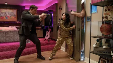 Jackpot! Movie Outfits: Katie (Awkwafina) is wearing Gold sneakers