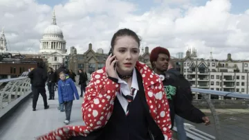 Ruby Red Movie Outfits: Gwendolyn Shepherd (Maria Ehrich) wears Red printed trench coat with white dots