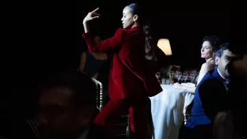 Wardrobe of Emilia Pérez Movie: Zoe Saldana wears Blazer and pants red suit set to portray Rita Moro Castro