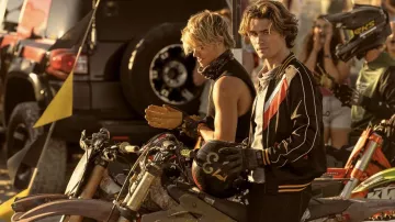 Wardrobe of Outer Banks Season 4: John B Routledge (Chase Stokes)  is wearing Black bomber jacket to drive his motorcycle