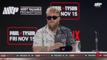 Jake Paul was wearing Black sunglasses for the Jake Paul vs. Mike Tyson: Press Conference at FanaticsFest live on August 18, 2024