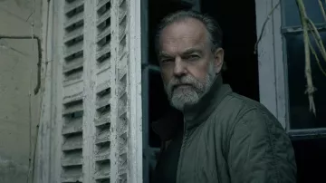 Wardrobe of Slow Horses: Hugo Weaving wears Olive Green Quilted Bomber Jacket to play Frank Harkness in season 4, episode 2