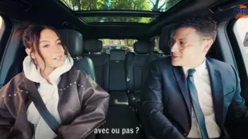 Adèle Exarchopoulos wears a studded brown leather jacket in the video Loris Giuliano & Adèle Exarchopoulos on a walk