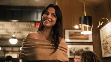 Brown ruched off shoulder foldover sweater of Nikki Freeman (Inde Navarrette) in Obsession