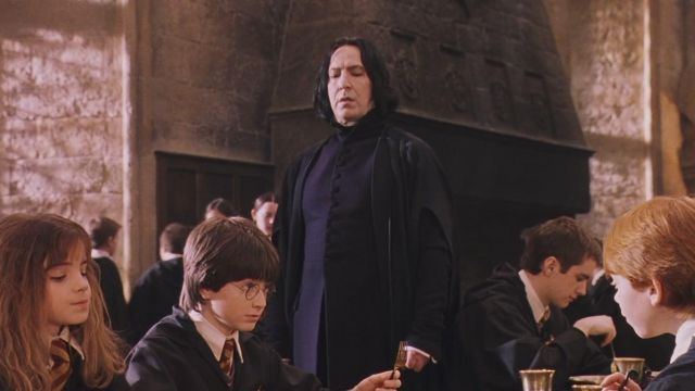 Holding Severus Rogue (Alan Rickman) in Harry Potter and the sorcerer's