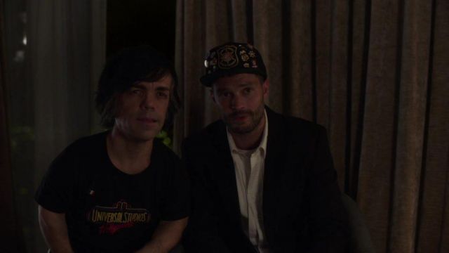 The black t-shirt Universal Studios worn by Hervé Villechaize (Peter Dinklage) in My Dinner With Hervé