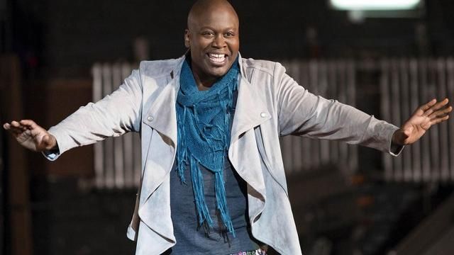 Gray waterfall jacket worn by Titus Andromedon (Tituss Burgess) in Unbreakable Kimmy Schmidt S01E04