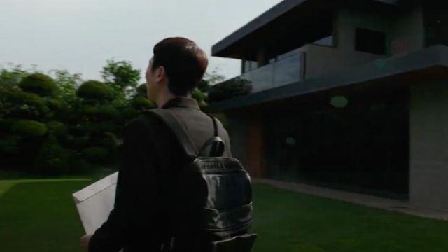 The backpack black worn by Ki-woo, Ki-taek's its (Woo-sik Choi) in Parasite