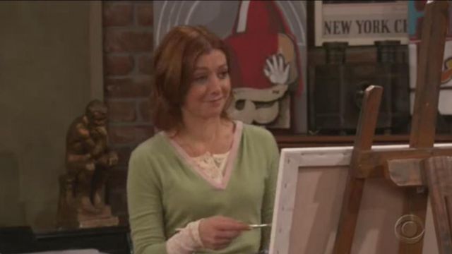 Red poster on the fireplace as seen in How I met your mother