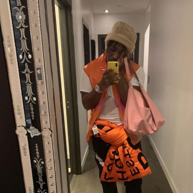 Orange sleeveless raincoat worn by Juice WRLD on his Instagram