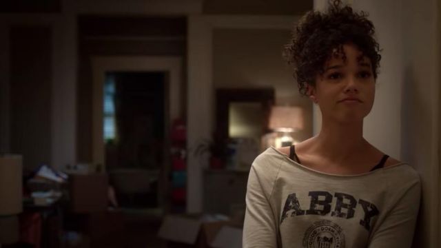ABBY grey t-shirt worn by Nicole Warren (Alisha Wainwright) in Raising Dion Season 1
