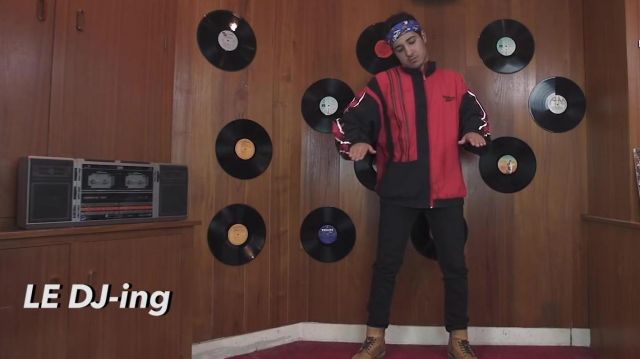 The Reebok jacket red and black worn by Sofyan in the video The HISTORY OF RAP by Seb the Fries