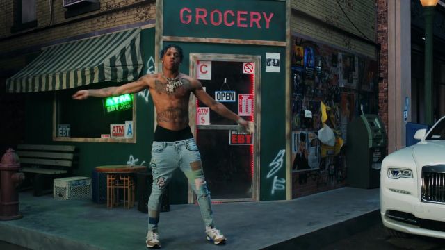 Denim pants with patches worn by NLE Choppa in his Walk Em Down music video  feat. Roddy Ricch