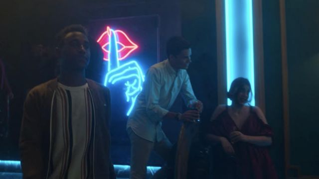 The sweater in stripe worn by Malick (Leïti Sene) in the series Elite (Season 3 Episode 4)