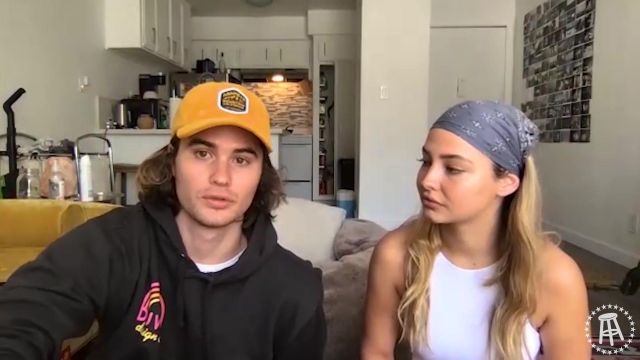 The Cap And The Yellow Worn By Chase Stokes In The Video Outer Banks Stars Chase Stokes Madelyn Cline Is How They Landed Roles Spotern