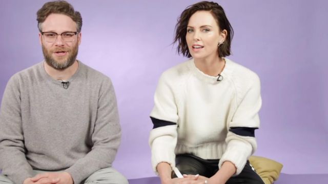 White sweater worn by Charlize Theron in Seth Rogen and Charlize Theron Play With Puppies While Answering Fan Questions YouTube video