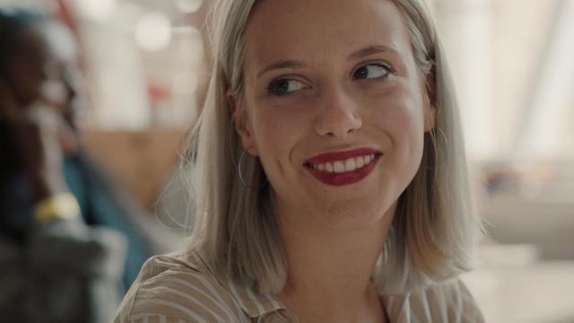 The beige striped blouse of Zoe Loockx (Veerle Dejaer) in wtFOCK (S01E03)