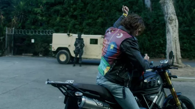 The leather jacket printed in the back worn by Nico (KJ Apa) as seen in Songbird movie outfits