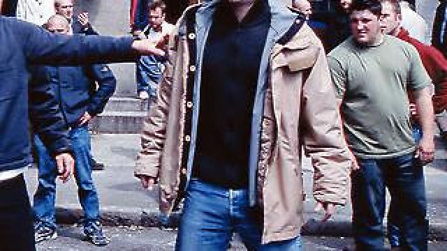 The beige jacket worn by Tommy Johnson Danny Dyer in The Football Factory