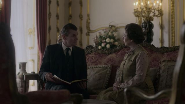 Mustard sleeveless dress worn by Queen Elizabeth II (Olivia Colman) as seen in The Crown (S04E05) TV series