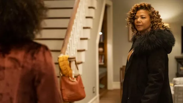 Black coat with fur collar worn by Robyn McCall (Queen Latifah) as seen in The Equalizer TV series wardrobe (Season 1 Episode 1)