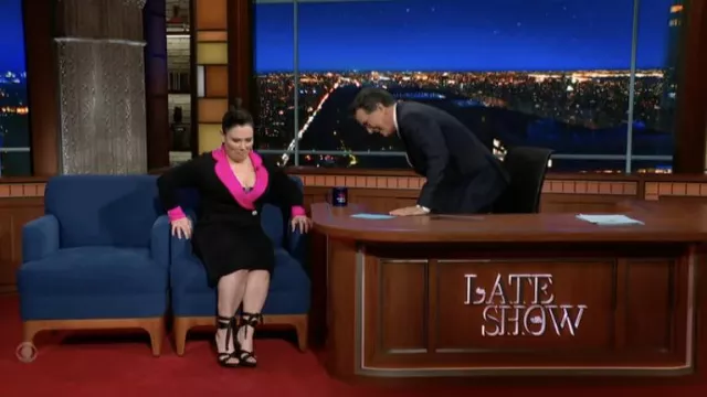 Black dress with pink collar worn by Alex Borstein as seen in The Late Show with Stephen Colbert on February 14, 2022