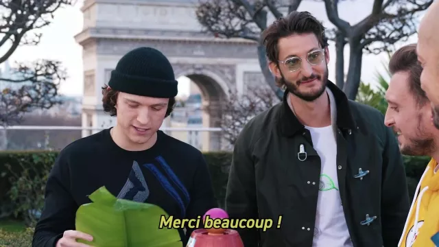 The coat of Pierre Niney in the YouTube video We simply played Pic Pirate with Tom Holland (we are in which multiverse already?)