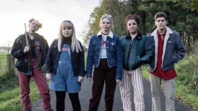 Striped trousers worn by Michelle Mallon (Jamie-Lee O'Donnell) in Derry Girls TV series outfits (Season 2 Episode 3)