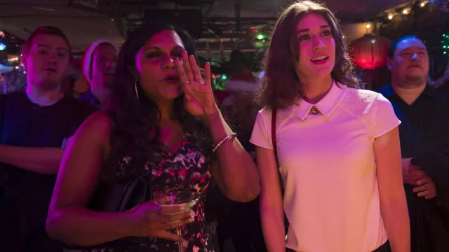 Diana's (Lizzy Caplan) white polo shirt with beaded collar and shoulder in the movie The Night Before
