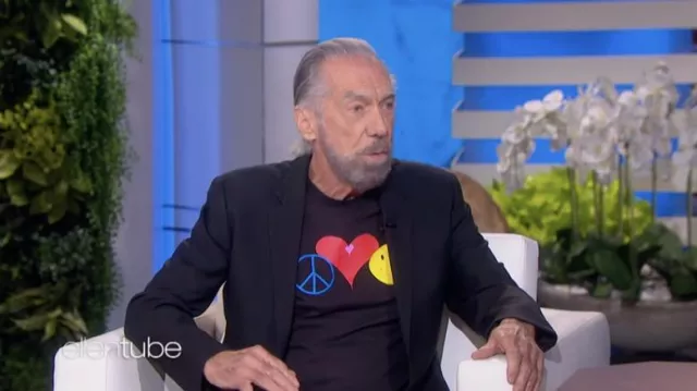 Black t-shirt with peace, heart and smiley symbols worn by John Paul DeJoria in The Ellen DeGeneres Show