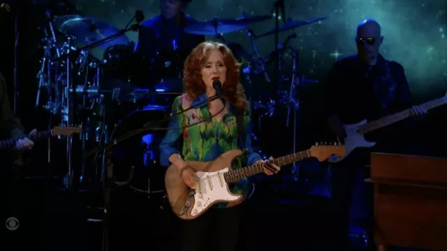 Multicolor printed button down shirt worn by Bonnie Raitt as seen in The Late Show with Stephen Colbert on June 14, 2022