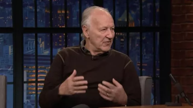 Brown crewneck sweater worn by Werner Herzog as seen in Late Night with Seth Meyers