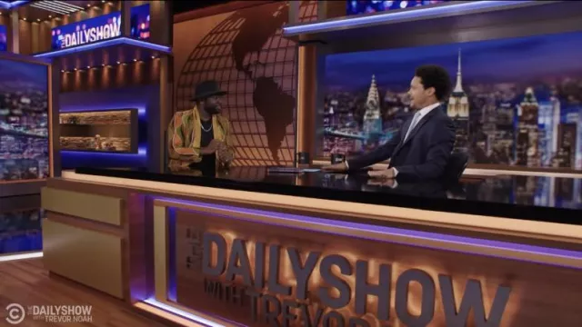 Yellow printed suit worn by Blitz Bazawule as seen in The Daily Show with Trevor Noah