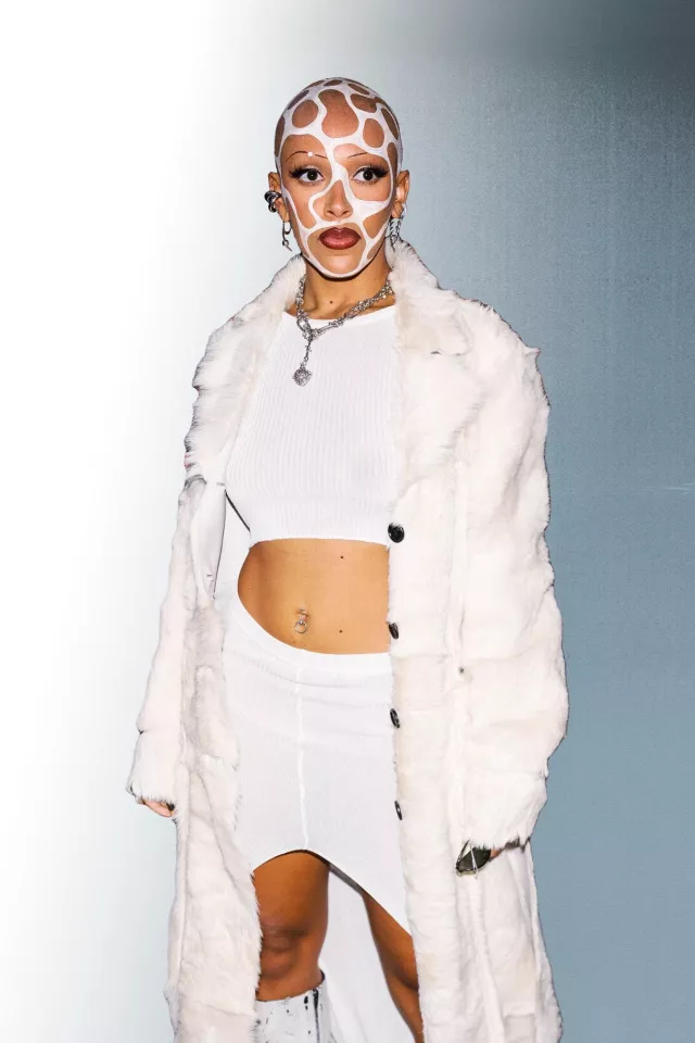 Fluffy jacket in white worn by Doja Cat for Magazine's Vogue World show on September 2022