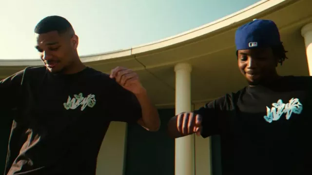 The brown t-shirt worn by Evan in his music video SÉRÉNA Feat. Moby