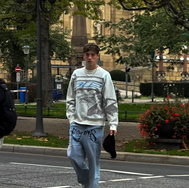 The blue-grey and white patterned sweater worn by Daniel Litke on his ...