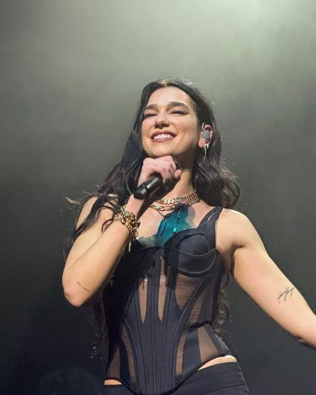 The openwork black corset worn on stage in Melbourne, Australia by Dua Lipa on the Instagram account of @lipa.fanstr