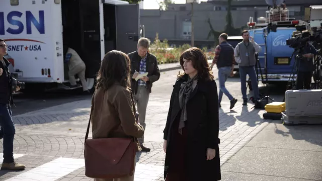 Brown leather crossbody bag worn by Eileen Fitzgerald (Hilary Swank) as seen in Alaska Daily TV series (S01E06)