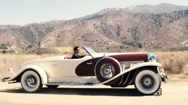 Red and white convertible car driven by Jack Conrad (Brad Pitt) in Babylon movie