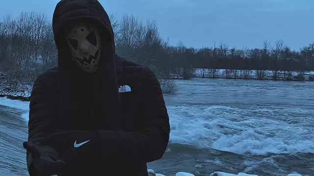 The North Face hooded jacket worn by menace Santana in his music video Skiboy