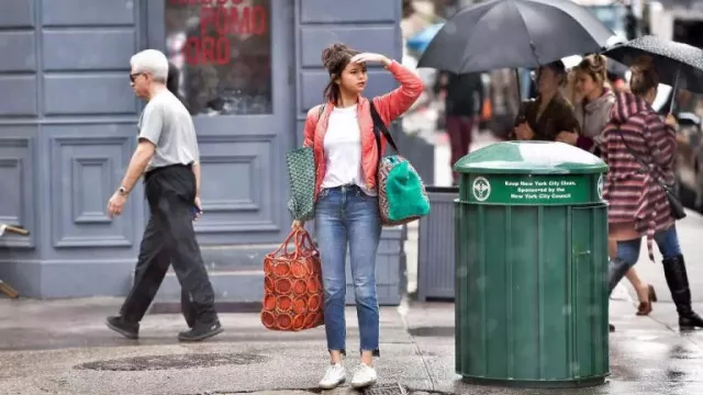 Oversize orange handbag worn by Chan (Selena Gomez) as seen in A Rainy Day in New York