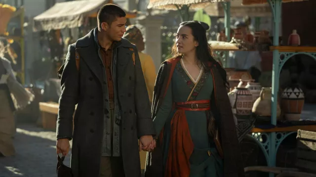 Grey long coat worn by Malyen Oretsev (Archie Renaux) as seen in Shadow and Bone TV series outfits (Season 2)
