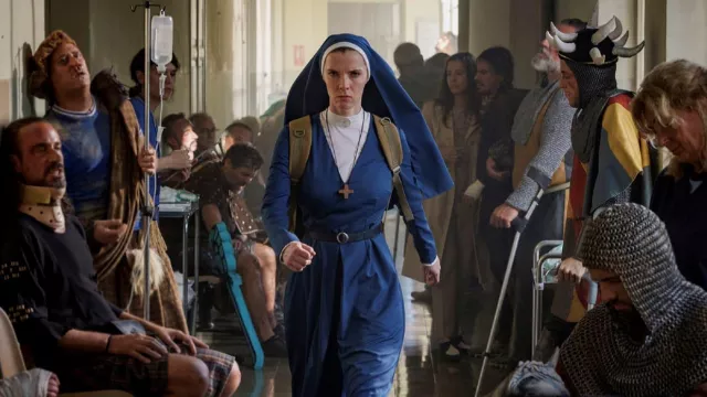 Blue costume worn by Simone (Betty Gilpin) as seen in Mrs. Davis TV series outfits (Season 1)
