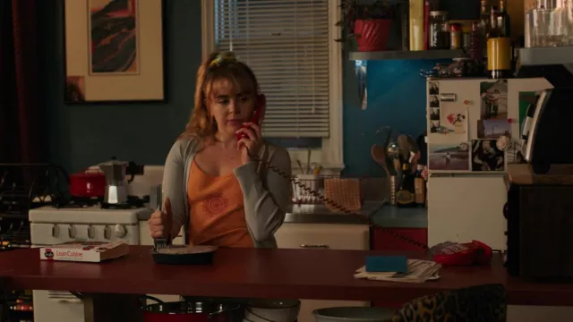 Sun printed orange top worn by Lindsay (Mae Whitman) as seen in Up Here TV show (S01E02)