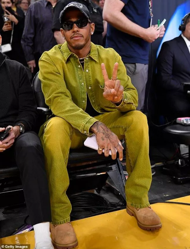 Green denim jacket and pants set worn by Lewis Hamilton at the Western Conference Semifinal Playoff game between the Los Angeles Lakers and Golden State Warriors at Crypto.com Arena on May 12, 2023 in Los Angeles.