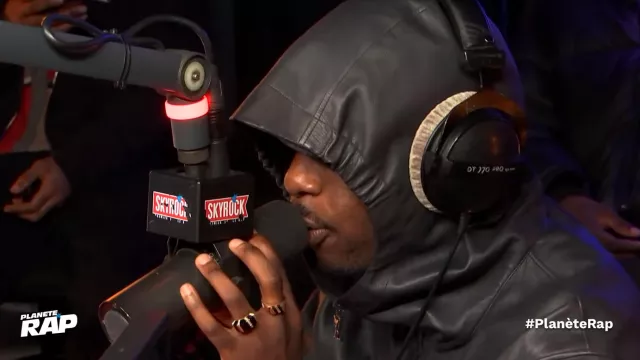 The Louis Vuitton hooded raincoat worn by Josman during his portrayal of Carlo on #PlanèteRap