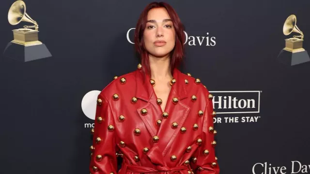 Red Leather Trench Coat dress worn by Dua Lipa at the Clive Davis Pre-GRAMMY party on February 2024